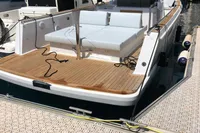2019 Fjord 36' Open yacht docked in a marina, featuring spacious deck and modern design.
