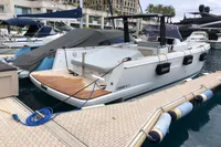 2019 Fjord 36' Open yacht docked at marina with luxury boats.