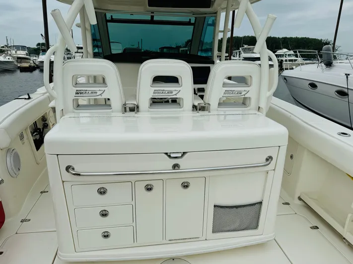 Triple Play Yacht Photos Pics 2015 Boston Whaler 370 Outrage boat interior with seating and storage compartments.