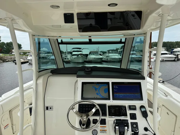 Triple Play Yacht Photos Pics Cockpit view of 2015 Boston Whaler 370 Outrage with advanced navigation system.