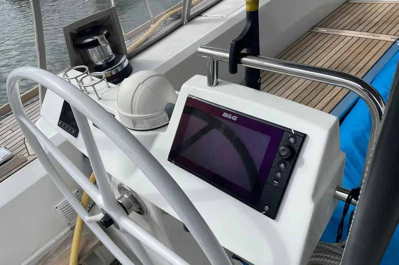 Genka Yacht Photos Pics Cockpit of 2017 Beneteau Sense 50 yacht with navigation equipment and steering wheel.