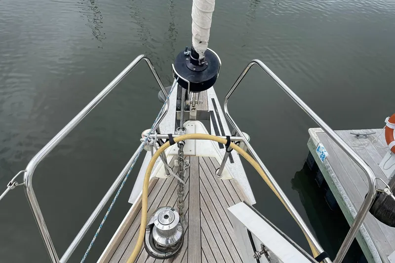 Genka Yacht Photos Pics Bow of 2017 Beneteau Sense 50 yacht with deck equipment and railing.