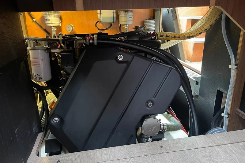 Genka Yacht Photos Pics Engine compartment of a 2017 Beneteau Sense 50 sailboat, showcasing mechanical components.