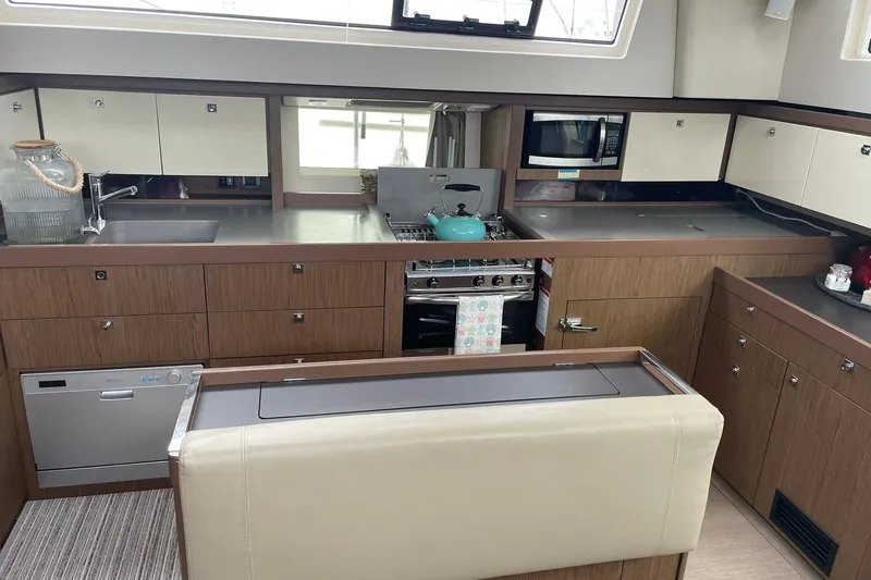 Genka Yacht Photos Pics Luxurious kitchen interior of 2017 Beneteau Sense 50 yacht with modern appliances.