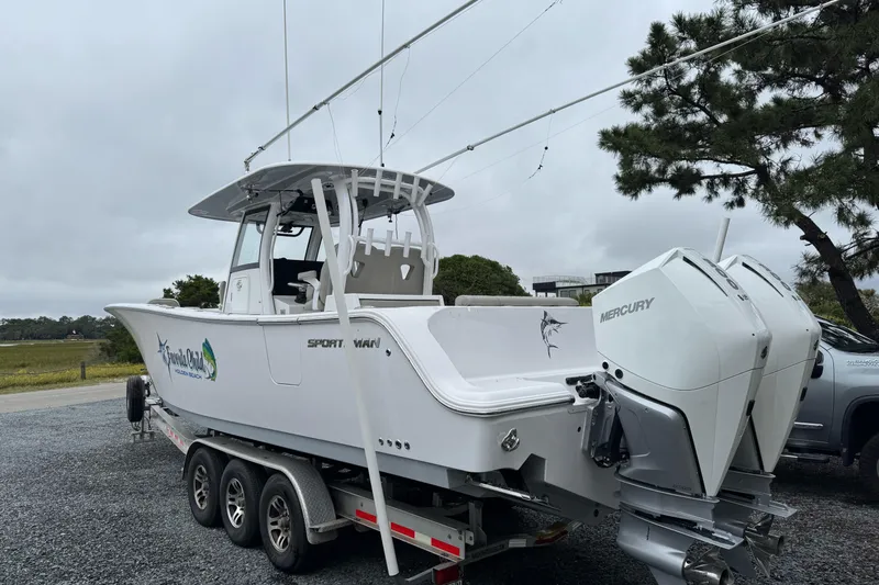  Yacht Photos Pics 2021 Sportsman Open 322 Center Console boat on trailer with twin Mercury engines.