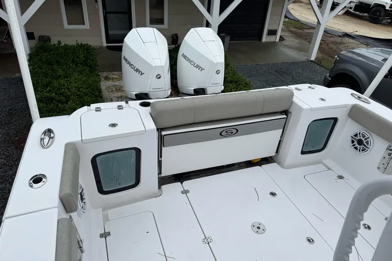  Yacht Photos Pics 2021 Sportsman Open 322 Center Console boat with dual Mercury engines, docked outdoors.