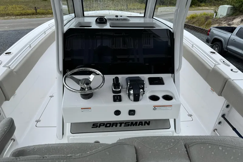  Yacht Photos Pics 2021 Sportsman Open 322 Center Console boat dashboard with steering wheel and controls.