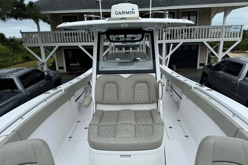  Yacht Photos Pics 2021 Sportsman Open 322 Center Console boat with cushioned seating and Garmin equipment.
