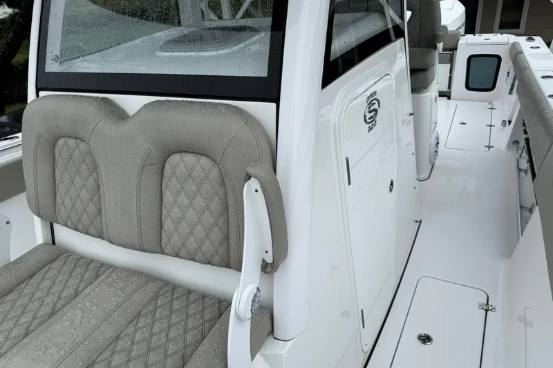  Yacht Photos Pics 2021 Sportsman Open 322 Center Console boat with cushioned seating and sleek design.