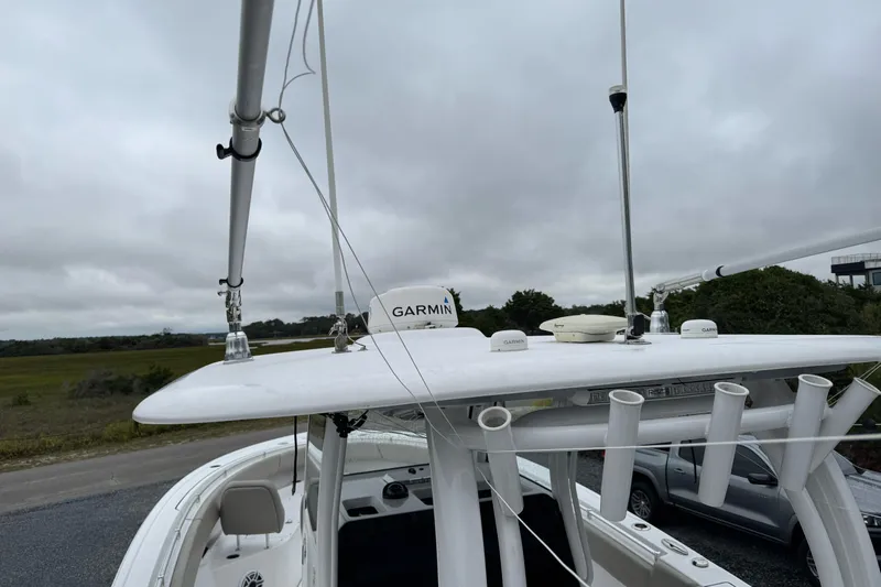  Yacht Photos Pics 2021 Sportsman Open 322 Center Console with Garmin equipment on a cloudy day.