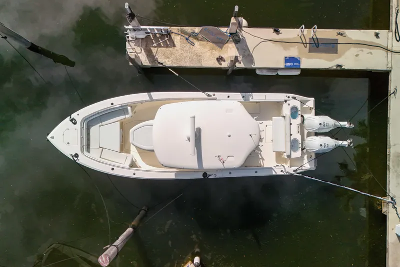  Yacht Photos Pics Overhead view of 2022 Cobia 350 Center Console boat docked in marina.