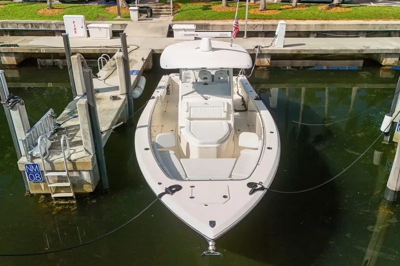  Yacht Photos Pics 2022 Cobia 350 Center Console boat docked in marina, aerial view.