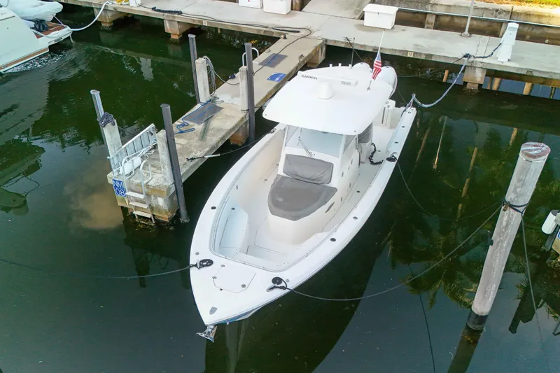  Yacht Photos Pics 2022 Cobia 350 Center Console boat docked in marina, aerial view.