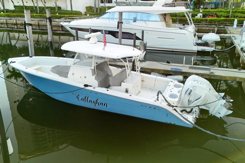  Yacht Photos Pics 2022 Cobia 350 Center Console boat docked in marina, featuring twin Yamaha engines.