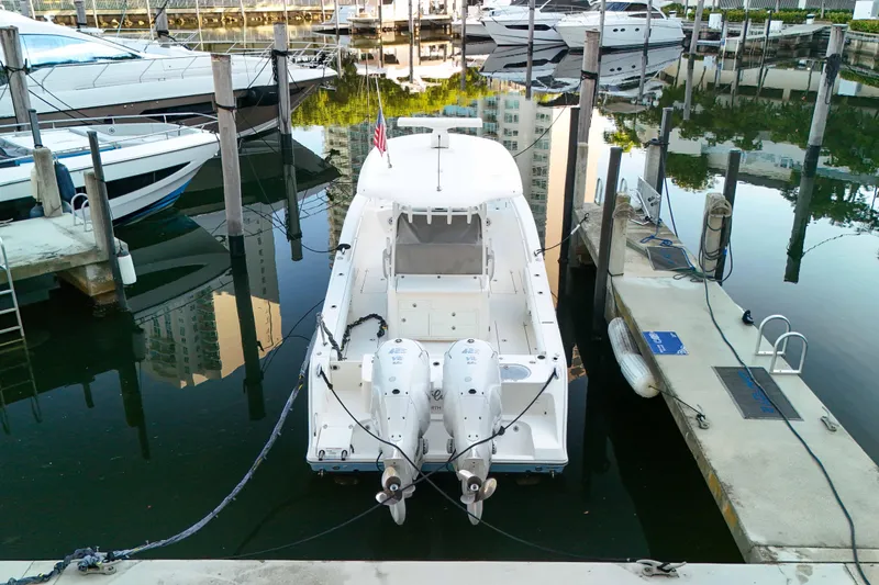  Yacht Photos Pics 2022 Cobia 350 Center Console docked at a marina with twin engines.