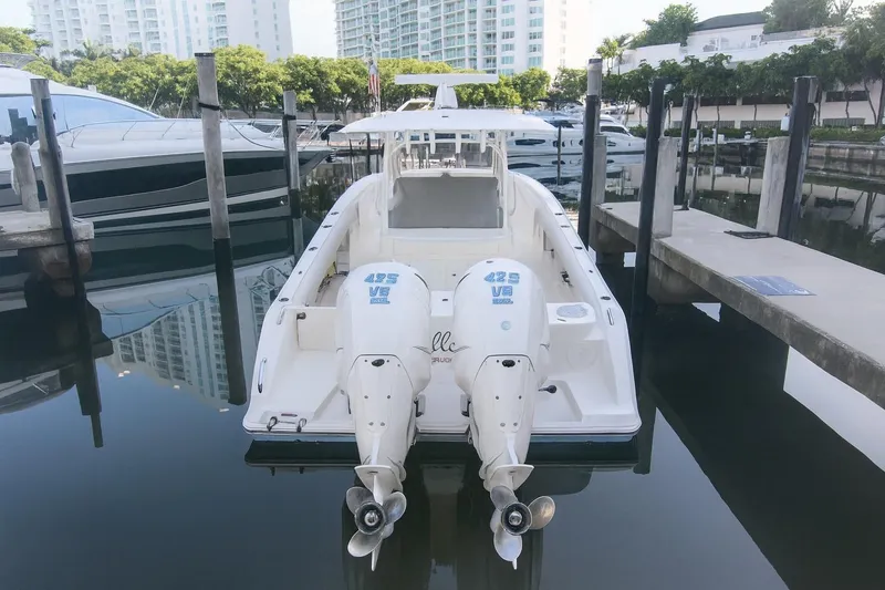  Yacht Photos Pics 2022 Cobia 350 Center Console boat docked at marina with twin engines.