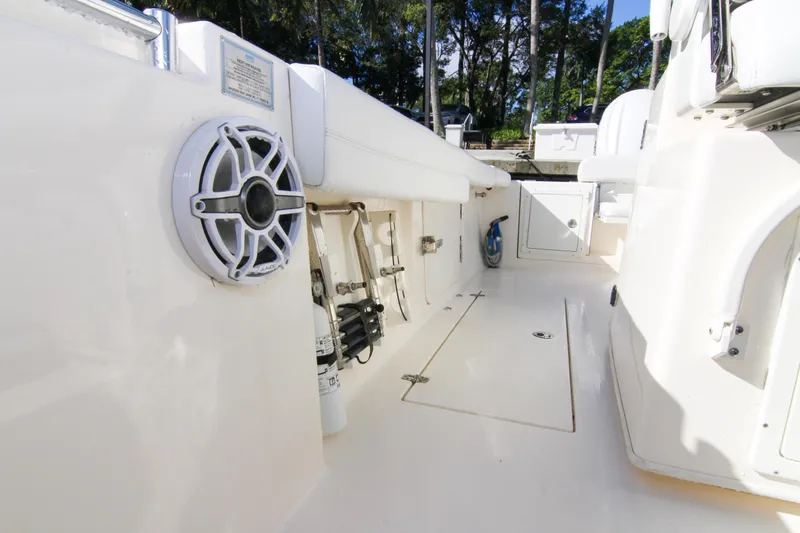  Yacht Photos Pics 2022 Cobia 350 Center Console boat interior with speaker and storage compartments.