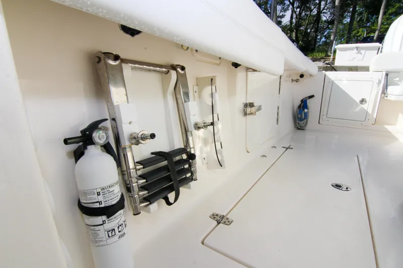  Yacht Photos Pics 2022 Cobia 350 Center Console boat interior with safety equipment and storage compartments.