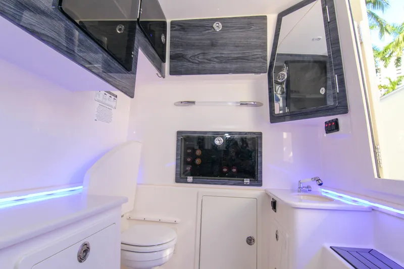  Yacht Photos Pics 2022 Cobia 350 Center Console interior with modern cabinetry and sleek design.