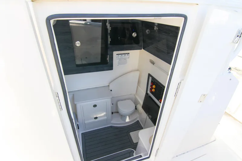  Yacht Photos Pics 2022 Cobia 350 Center Console boat interior with compact bathroom amenities.