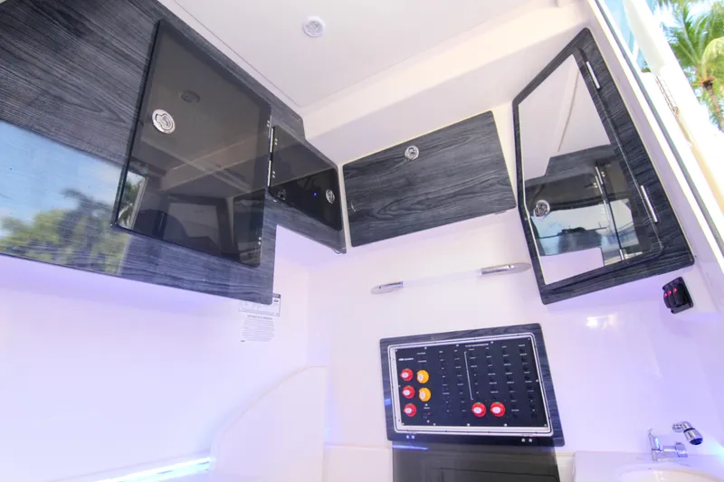  Yacht Photos Pics Interior of 2022 Cobia 350 Center Console with sleek cabinetry and control panel.