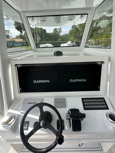  Yacht Photos Pics 2024 Onslow Bay 41 boat dashboard with Garmin displays and Mercury controls.