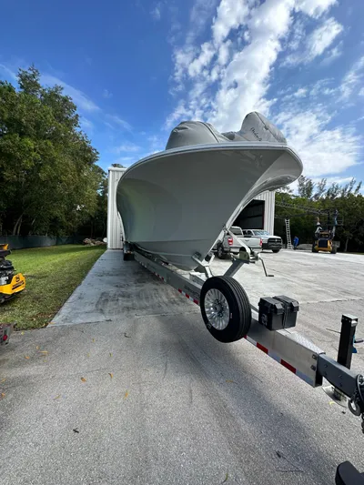  Yacht Photos Pics 2024 Onslow Bay 41 boat on trailer, parked outdoors under a partly cloudy sky.
