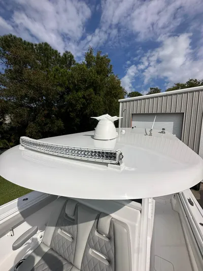  Yacht Photos Pics 2024 Onslow Bay 41 boat with radar and LED light bar under a cloudy sky.