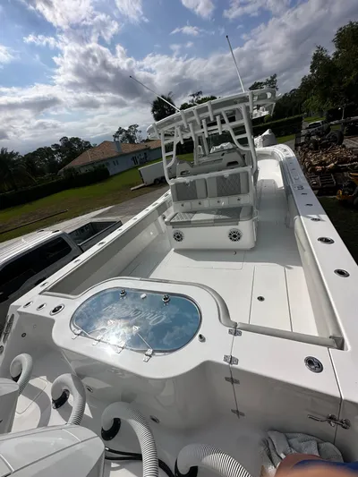  Yacht Photos Pics 2024 Onslow Bay 41 boat with spacious deck and modern design under a cloudy sky.