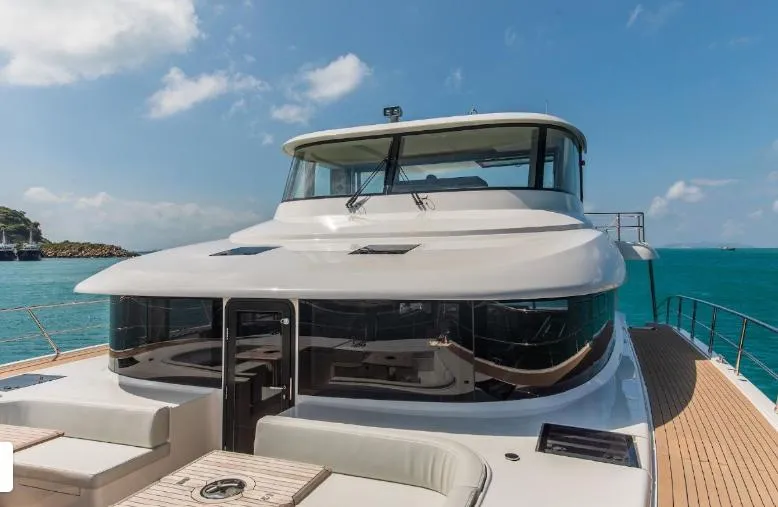 Bikini Sunset Yacht Photos Pics Luxury Granocean 57 yacht on clear blue sea, 2023 model.