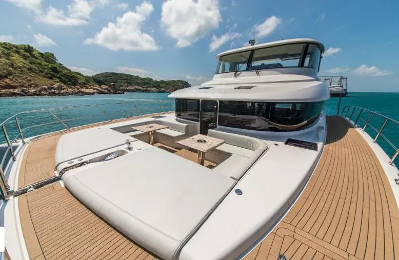 Bikini Sunset Yacht Photos Pics Luxury yacht Granocean 57, 2023, on open sea under sunny skies.