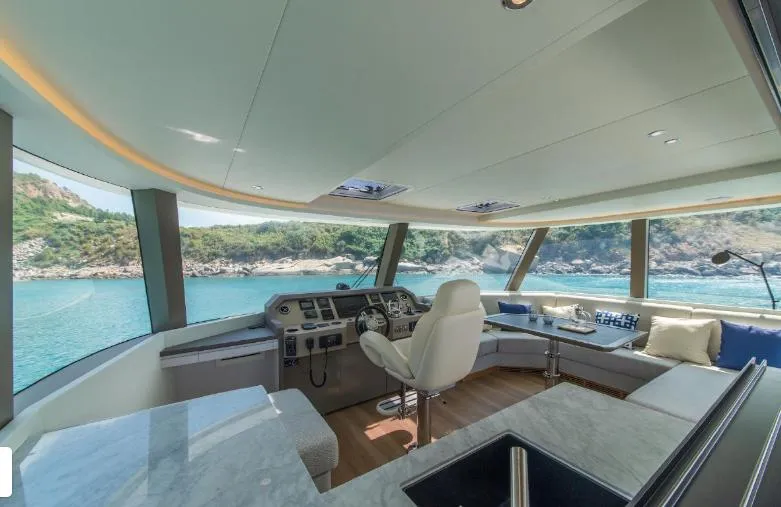 Bikini Sunset Yacht Photos Pics Luxurious interior of Granocean 57 yacht, 2023 model, with panoramic view.