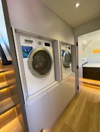 Bikini Sunset Yacht Photos Pics Modern laundry area on Granocean 57 yacht, 2023 model.