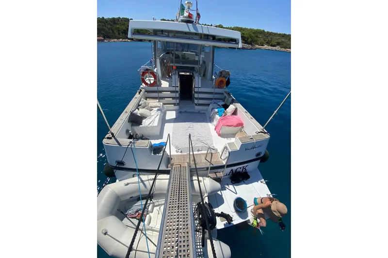 Captain Back Yacht Photos Pics Luxury yacht "Studio Mare Atmosfere 46" by Cantiere Navale di Pesaro, 1988, docked in serene waters.