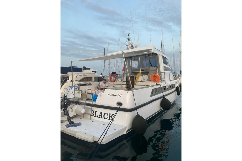Captain Back Yacht Photos Pics 1988 Cantiere Navale di Pesaro Studio Mare Atmosfere 46 yacht docked at marina.