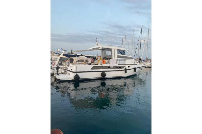 Captain Back Yacht Photos Pics 1988 Cantiere Navale di Pesaro Studio Mare Atmosfere 46 yacht docked in marina.
