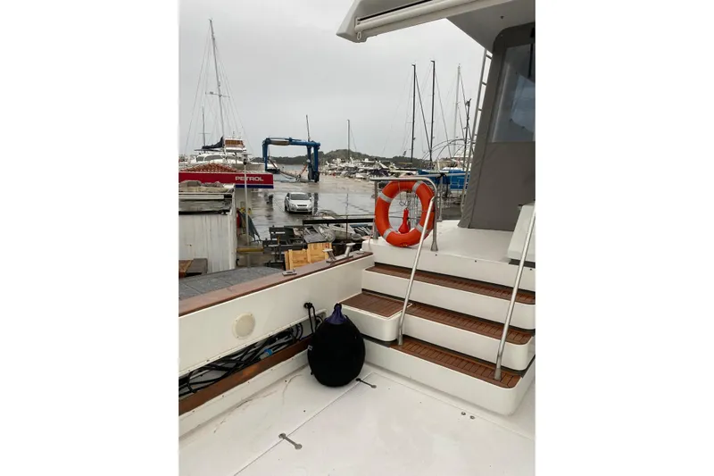 Captain Back Yacht Photos Pics Deck view of 1988 Cantiere Navale di Pesaro Studio Mare Atmosfere 46 yacht in marina.