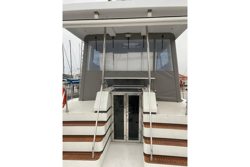 Captain Back Yacht Photos Pics 1988 Cantiere Navale di Pesaro Studio Mare Atmosfere 46 yacht, rear view with steps and canopy.