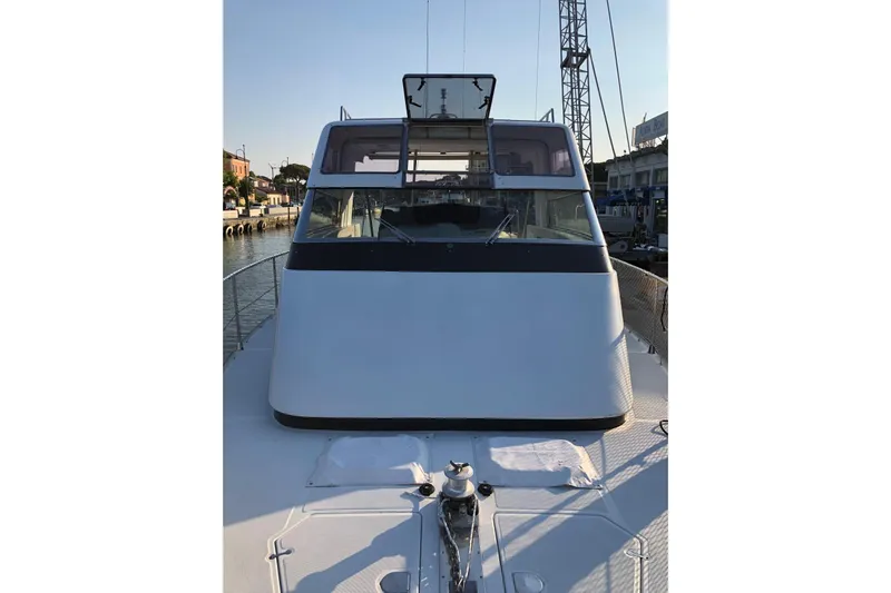 Captain Back Yacht Photos Pics 1988 Cantiere Navale di Pesaro Studio Mare Atmosfere 46 yacht docked at marina.