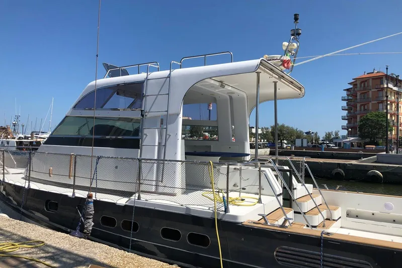 Captain Back Yacht Photos Pics 1988 Cantiere Navale di Pesaro Studio Mare Atmosfere 46 yacht docked at marina.
