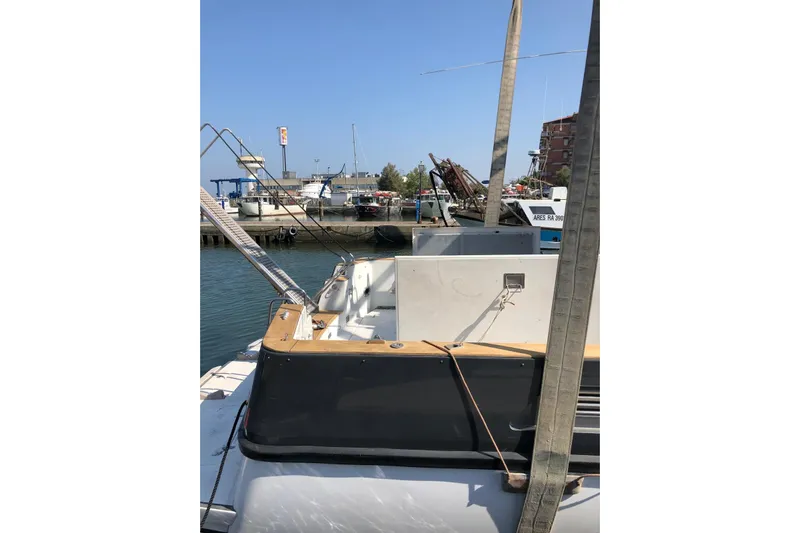 Captain Back Yacht Photos Pics 1988 Cantiere Navale di Pesaro Studio Mare Atmosfere 46 yacht docked at marina.