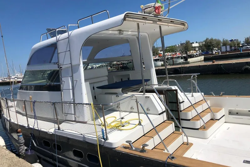 Captain Back Yacht Photos Pics 1988 Cantiere Navale di Pesaro Studio Mare Atmosfere 46 yacht docked at marina.