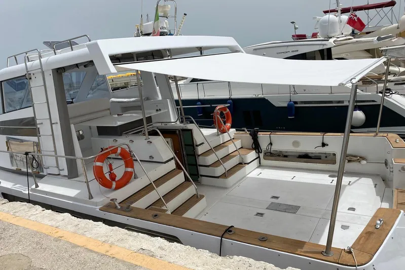 Captain Back Yacht Photos Pics 1988 Cantiere Navale di Pesaro Studio Mare Atmosfere 46 yacht docked at marina.