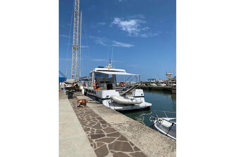 Captain Back Yacht Photos Pics 1988 Cantiere Navale di Pesaro Studio Mare Atmosfere 46 yacht docked at marina.