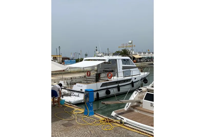Captain Back Yacht Photos Pics 1988 Cantiere Navale di Pesaro Studio Mare Atmosfere 46 yacht docked at marina.