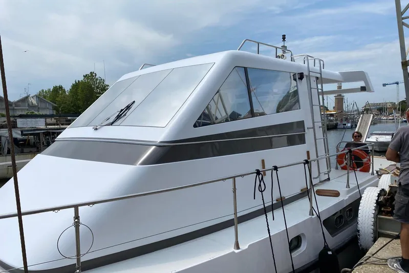 Captain Back Yacht Photos Pics 1988 Cantiere Navale di Pesaro Studio Mare Atmosfere 46 yacht docked at marina.