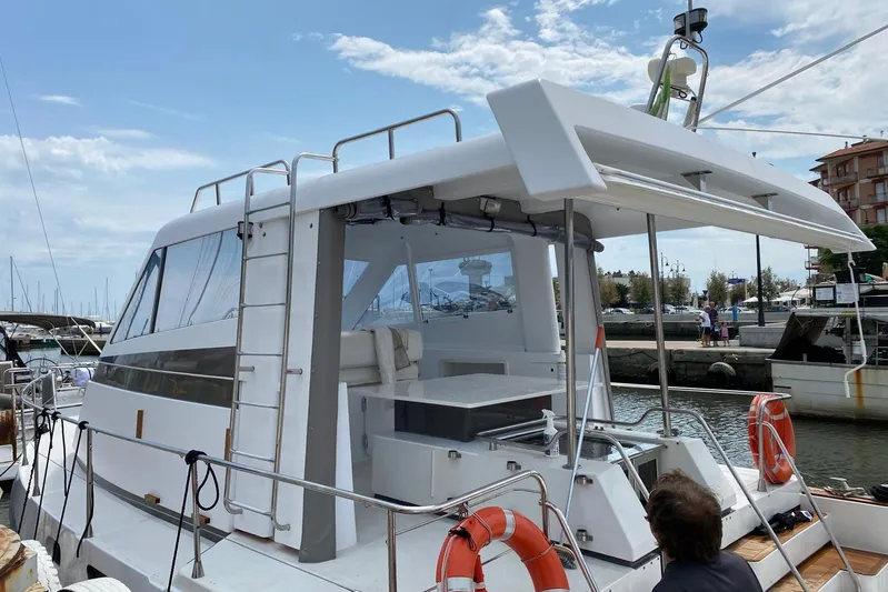 Captain Back Yacht Photos Pics 1988 Cantiere Navale di Pesaro Studio Mare Atmosfere 46 yacht docked at marina.