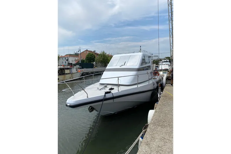 Captain Back Yacht Photos Pics 1988 Cantiere Navale di Pesaro Studio Mare Atmosfere 46 yacht docked at marina.
