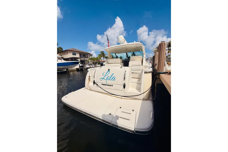 Lola Yacht Photos Pics 2005 Tiara Yachts 3600 Sovran docked, featuring spacious deck and elegant design.