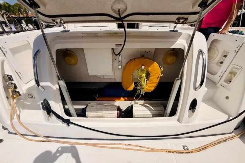 Lola Yacht Photos Pics Open storage compartment on 2005 Tiara Yachts 3600 Sovran with life preserver and equipment.